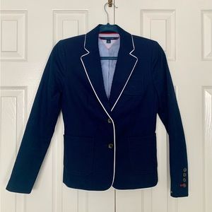 Tommy Hilfiger navy blazer with white trim. Size 0. Like new. Never worn.